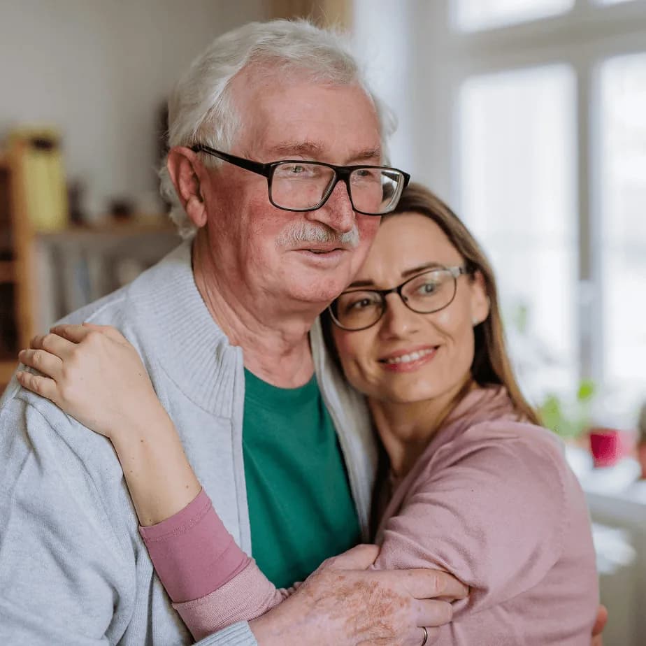 Older couple smiling, representing peace of mind from estate planning
